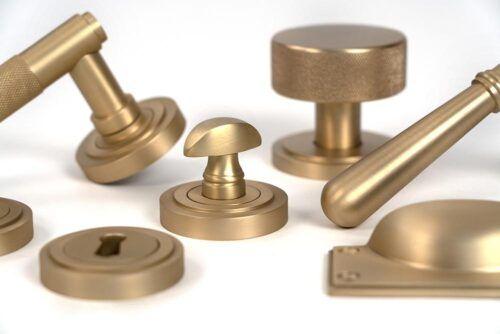 Discover the Elegance of "From the Anvil" Satin Brass Ironmongery