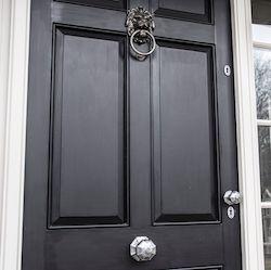 Black front door with chrome hardware