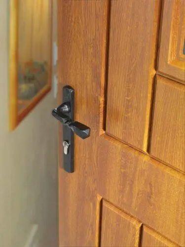 A Black Antique Multipoint Door Handle on Backplate on a dark wooden door | More Handles